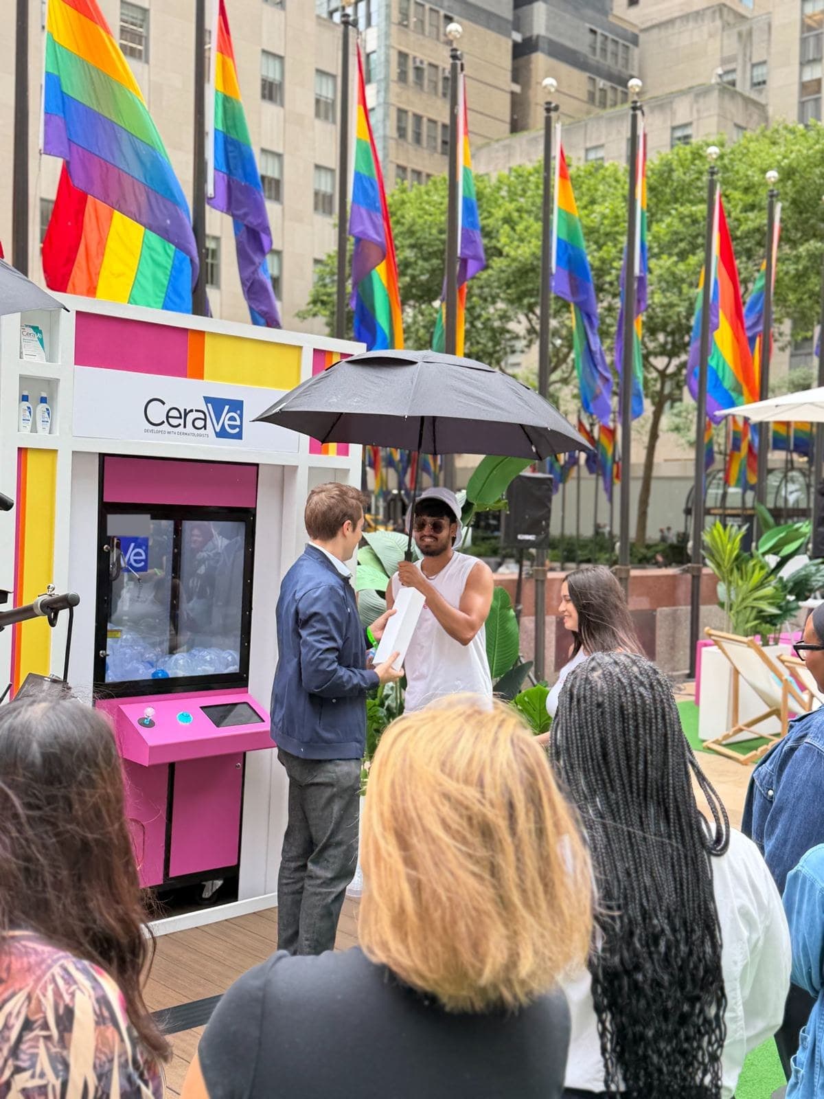 A winner receiving a prize at NBC's Love Island claw machine event